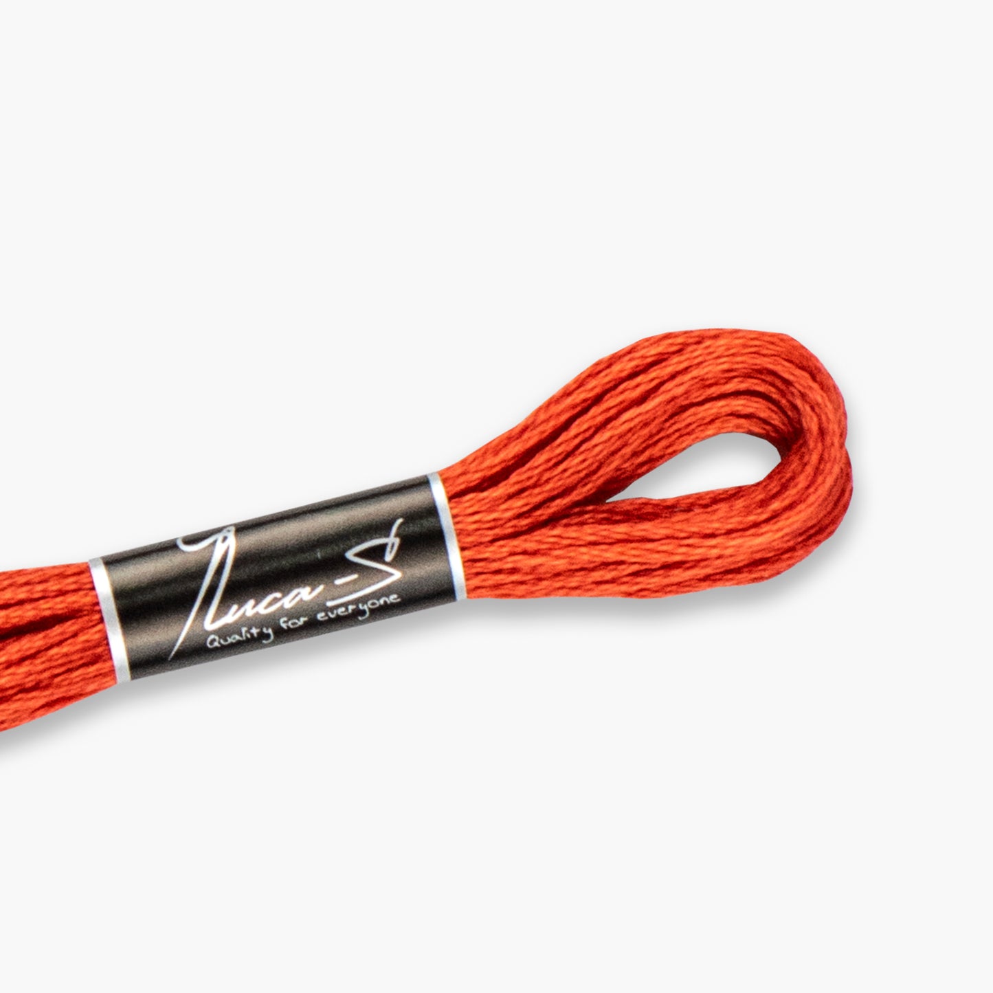 Orange embroidery floss with a label on a white background