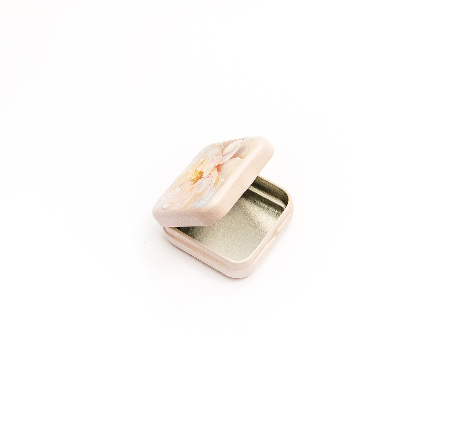 Small pink jewelry box with a floral design on a white background