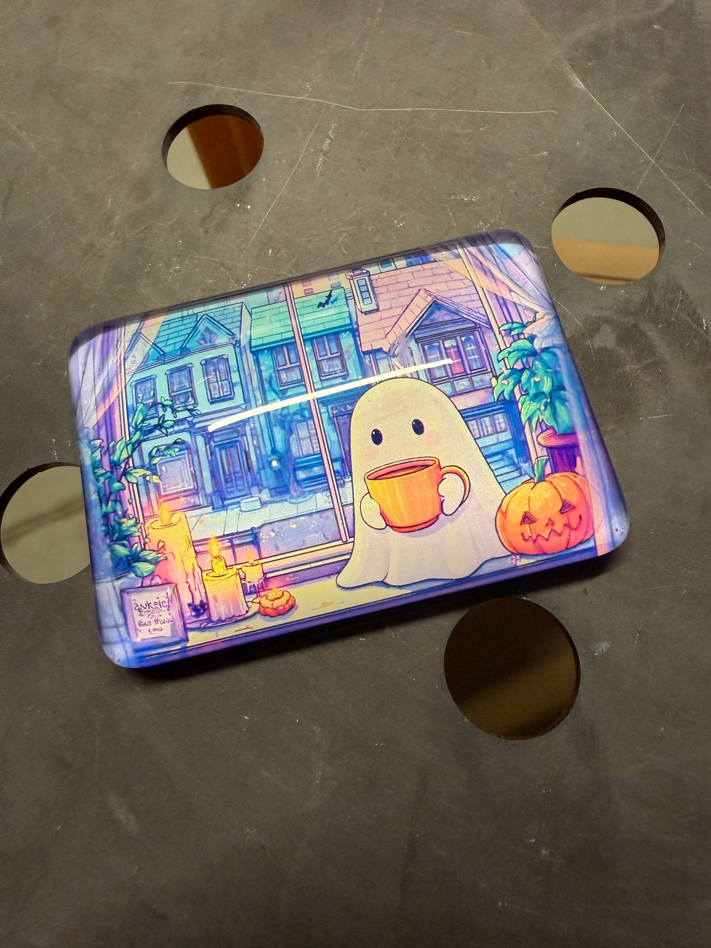 Colorful case with cartoon design on a gray surface