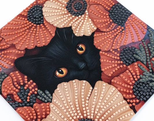 crystal art Black cat with orange eyes peeking out from a textured floral and shell pattern