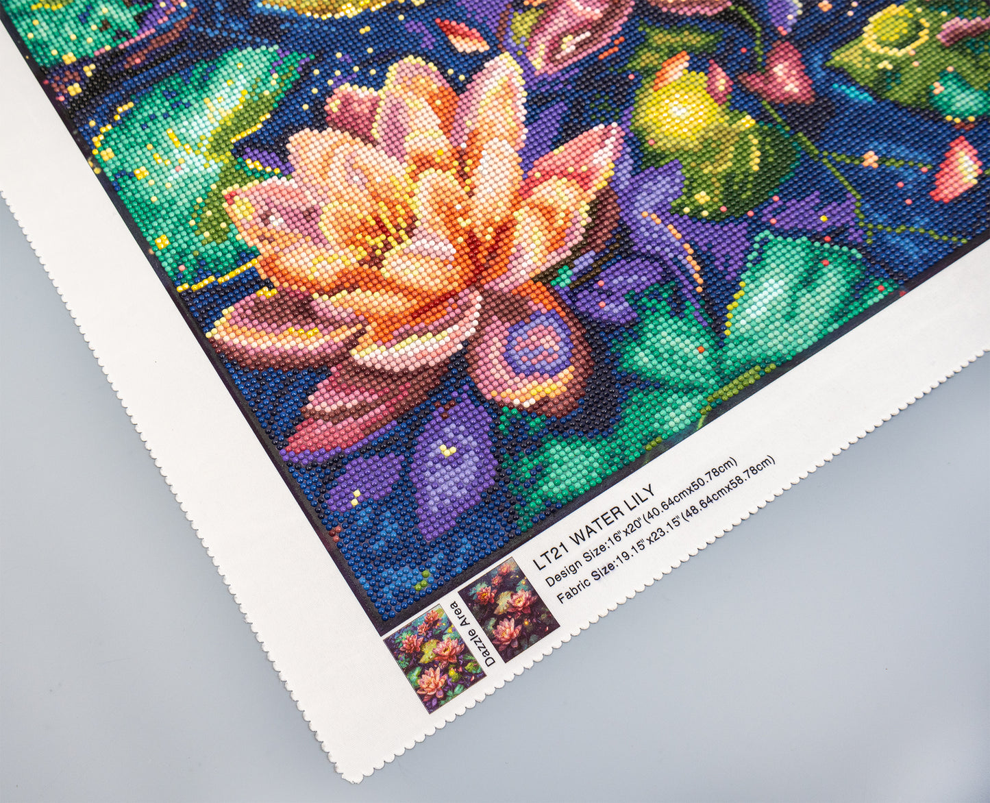 Colorful diamond painting of a water lily on a gray surface