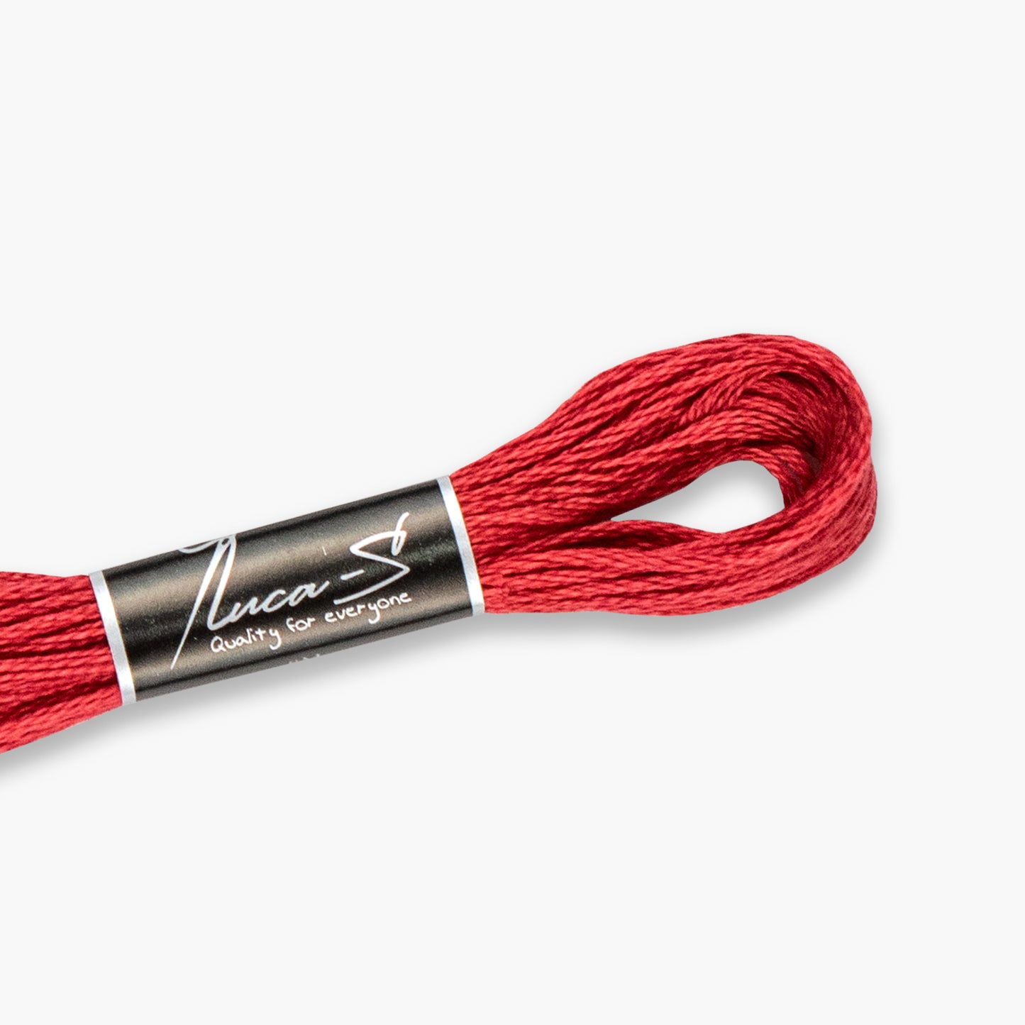 Red embroidery floss with a Luca-S label on a white background