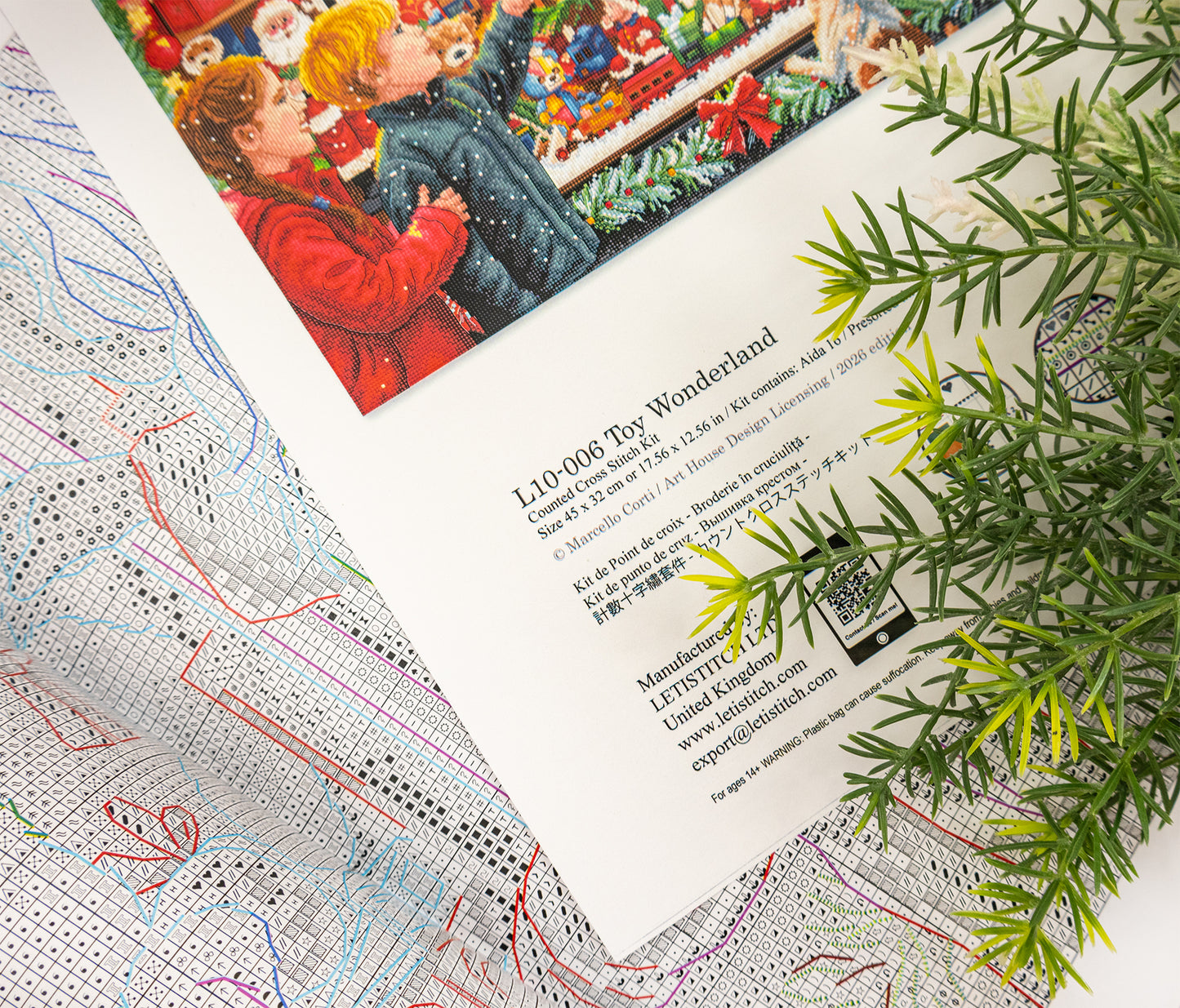 A printed craft pattern sheet titled 'L10-006 Toy Wonderland' from Art House Design Licensing, featuring an illustration of children playing with a toy car, styled with a green pine branch on a white background.