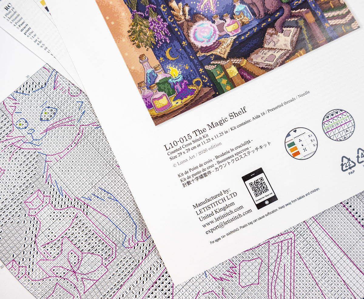 A printed kit card and cross-stitch fabric laid out on a white background. The card shows the title 'The Magic Shelf' and product details, alongside a colorful illustration of a fantasy scene.