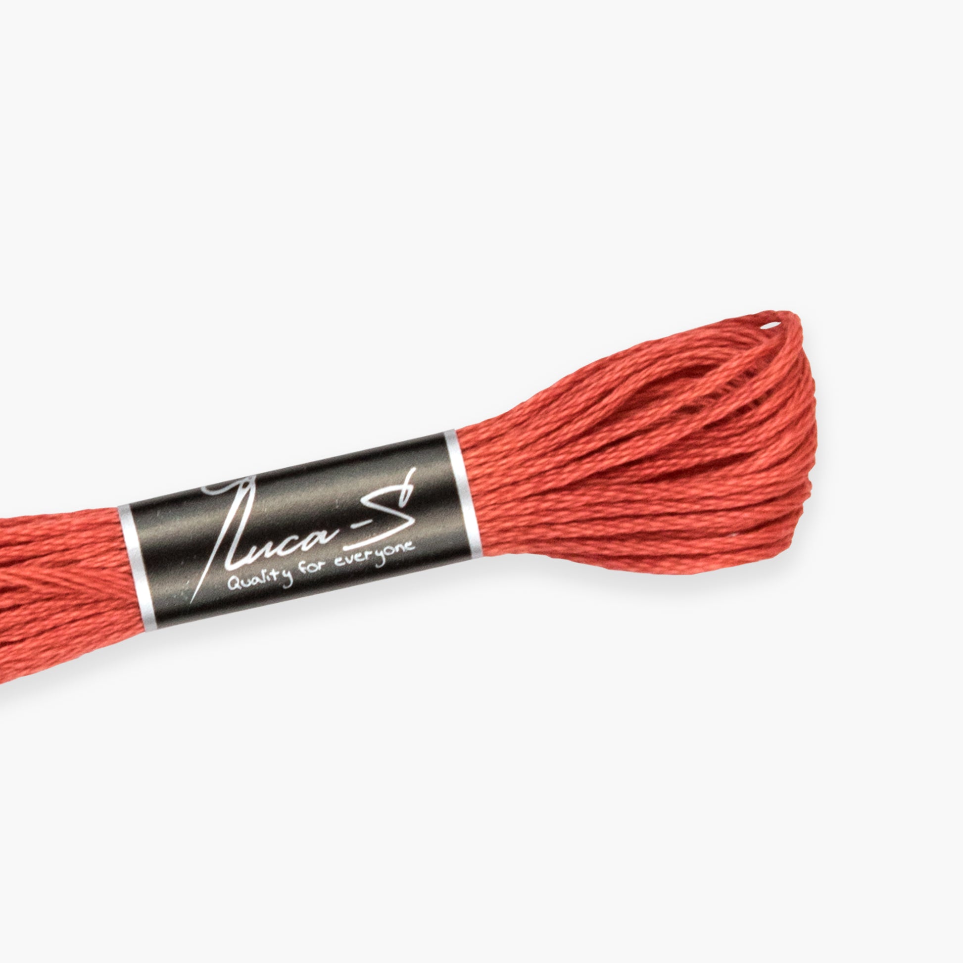 Red thread spool with 'Luca-S' label on a white background