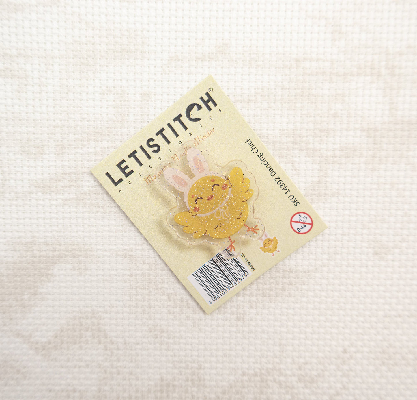 LetiStitch bunny rabbit charm on a beige card with a white background