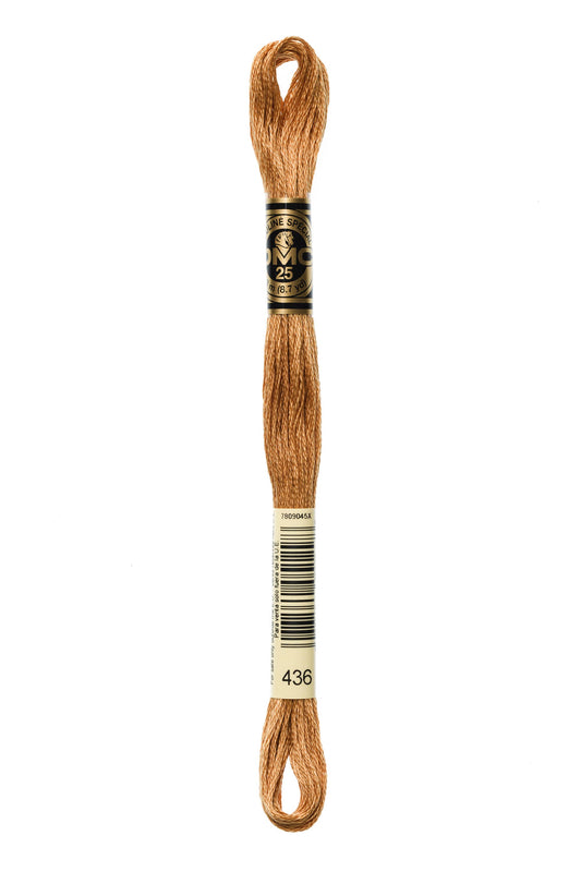 Brown embroidery floss spool with label on a white background