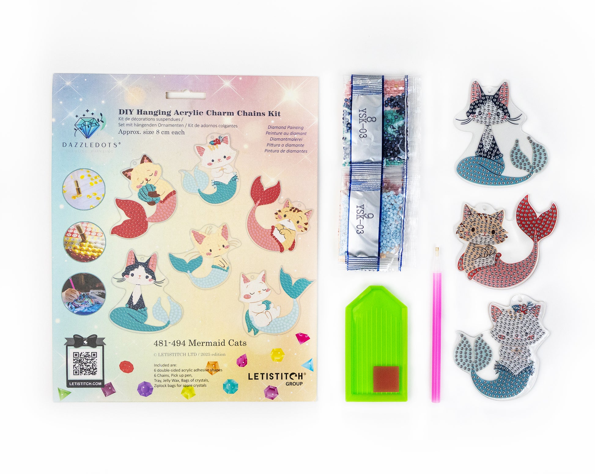 Mermaid cat acrylic charm kit with packaging and charms on a white background