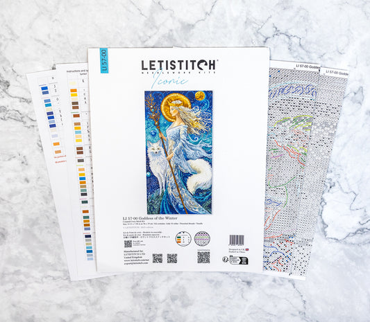 Letistitch embroidery kit with design chart on a marble surface