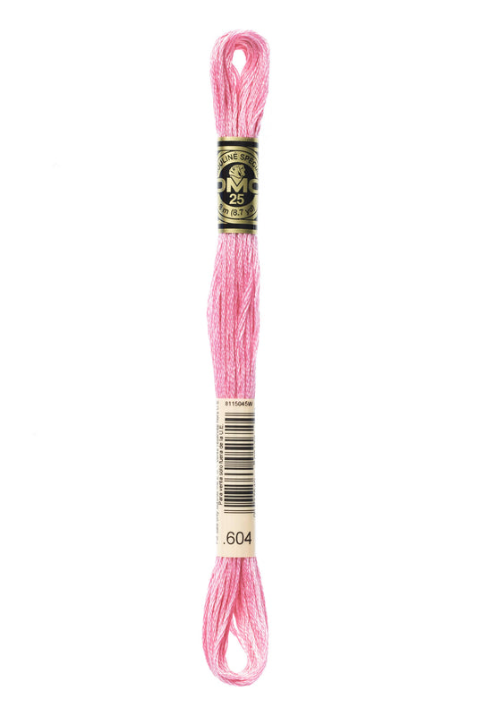 Pink embroidery floss on a white background