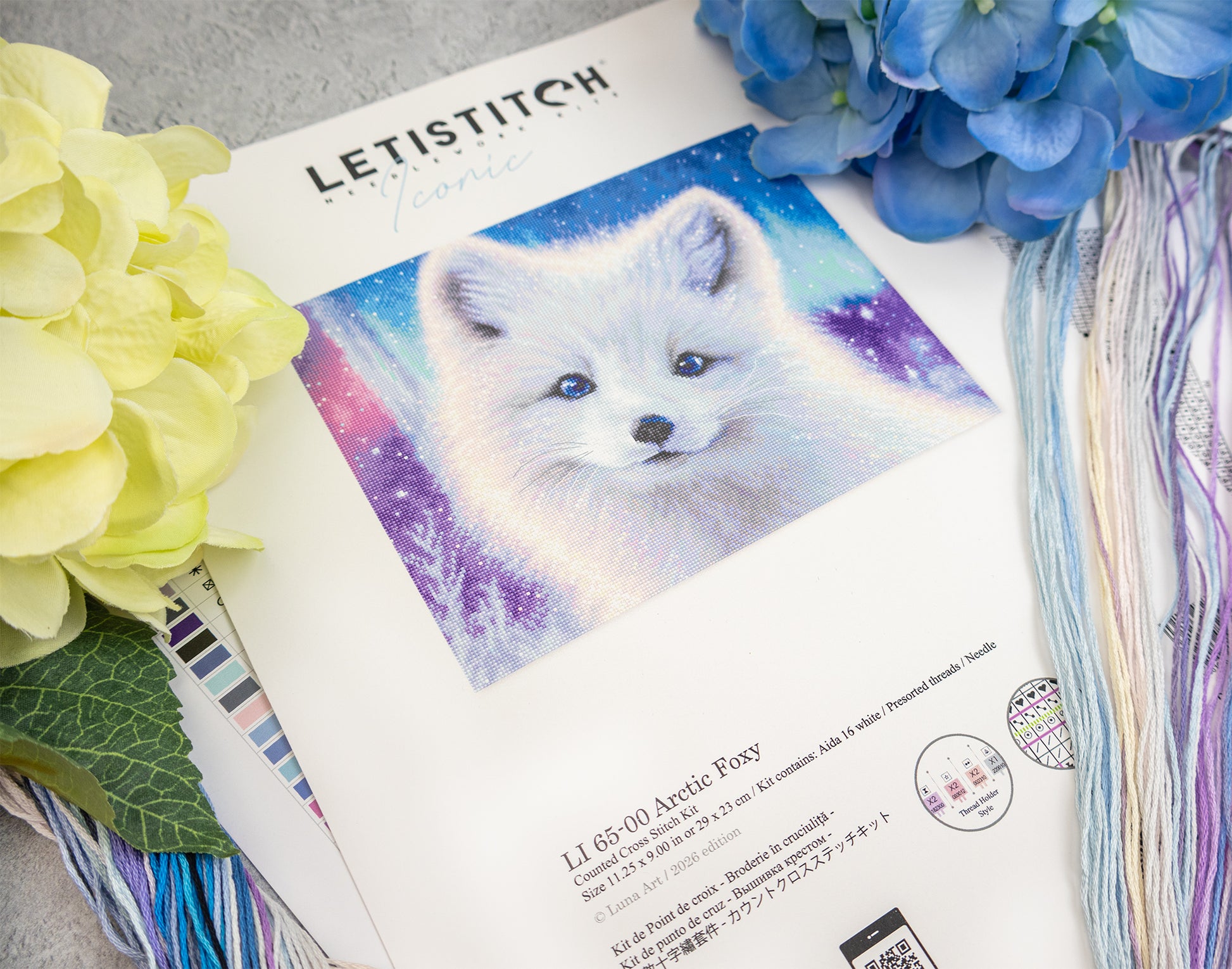 Letistitch product with a fox illustration and floral decorations on a textured surface