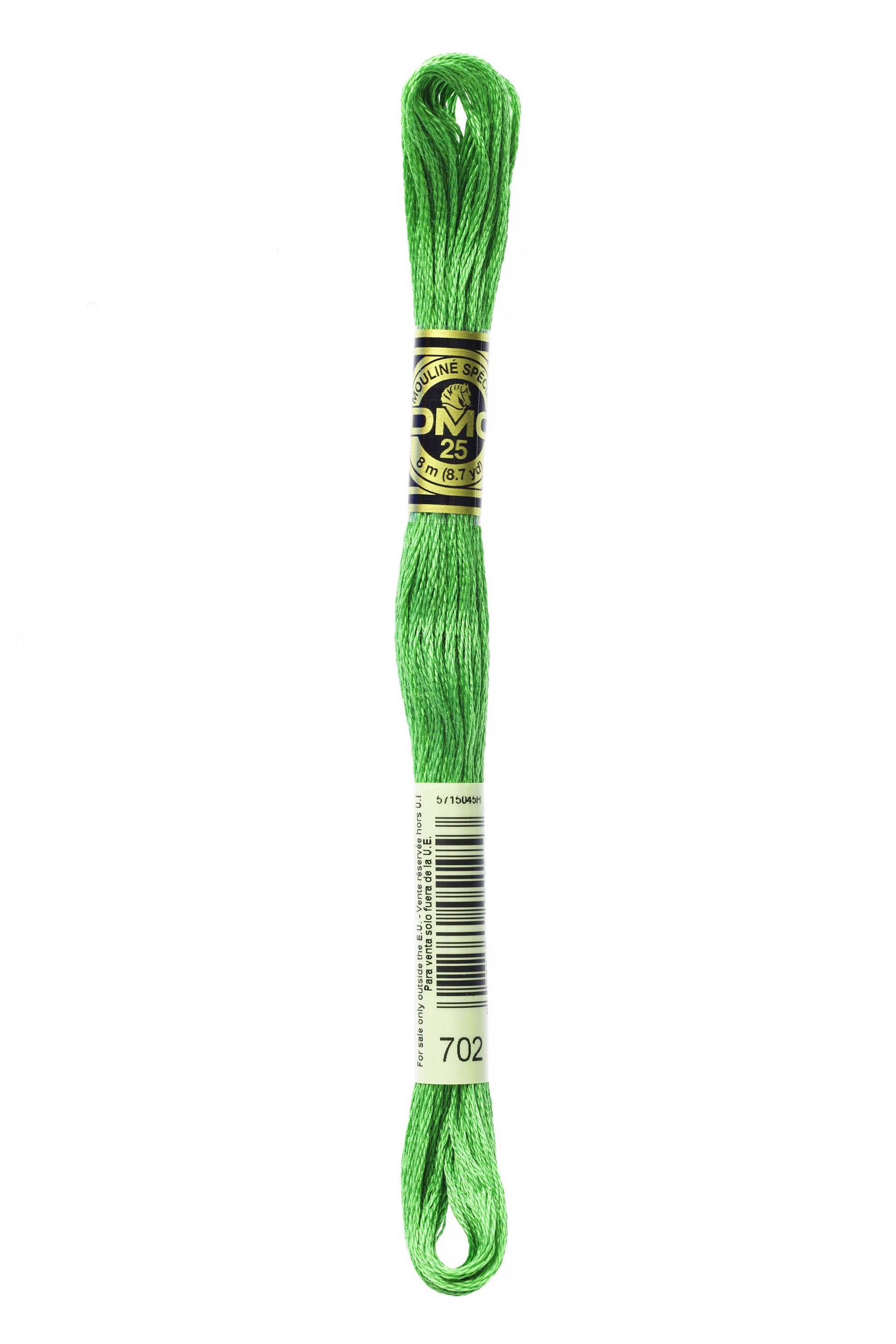 Green embroidery floss spool with a label on a white background