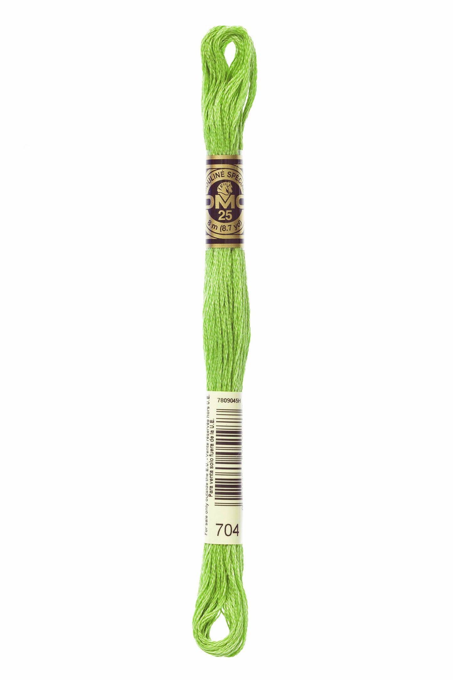 Green embroidery floss spool with a label on a white background