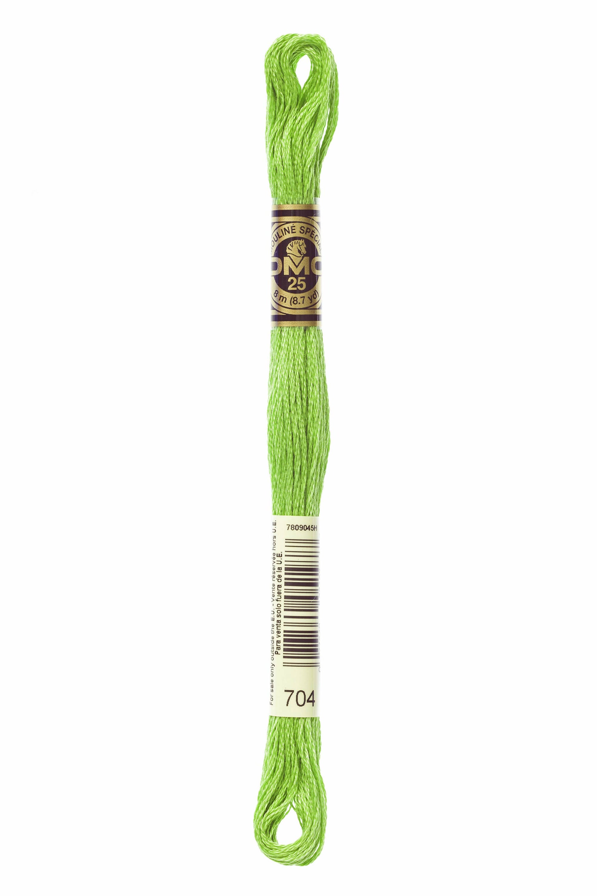 Green embroidery floss spool with a label on a white background