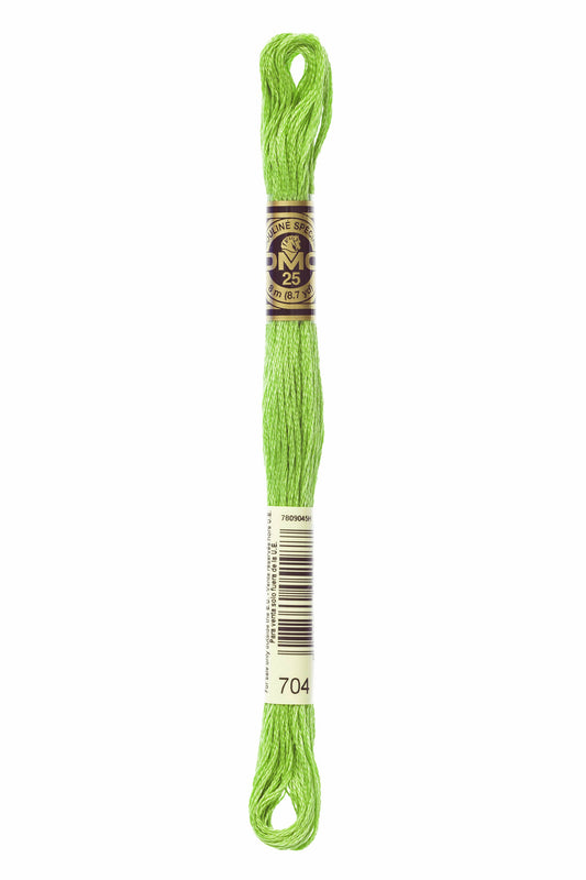 Green embroidery floss spool with a label on a white background