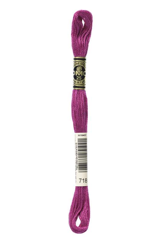 Purple embroidery floss spool with a label on a white background