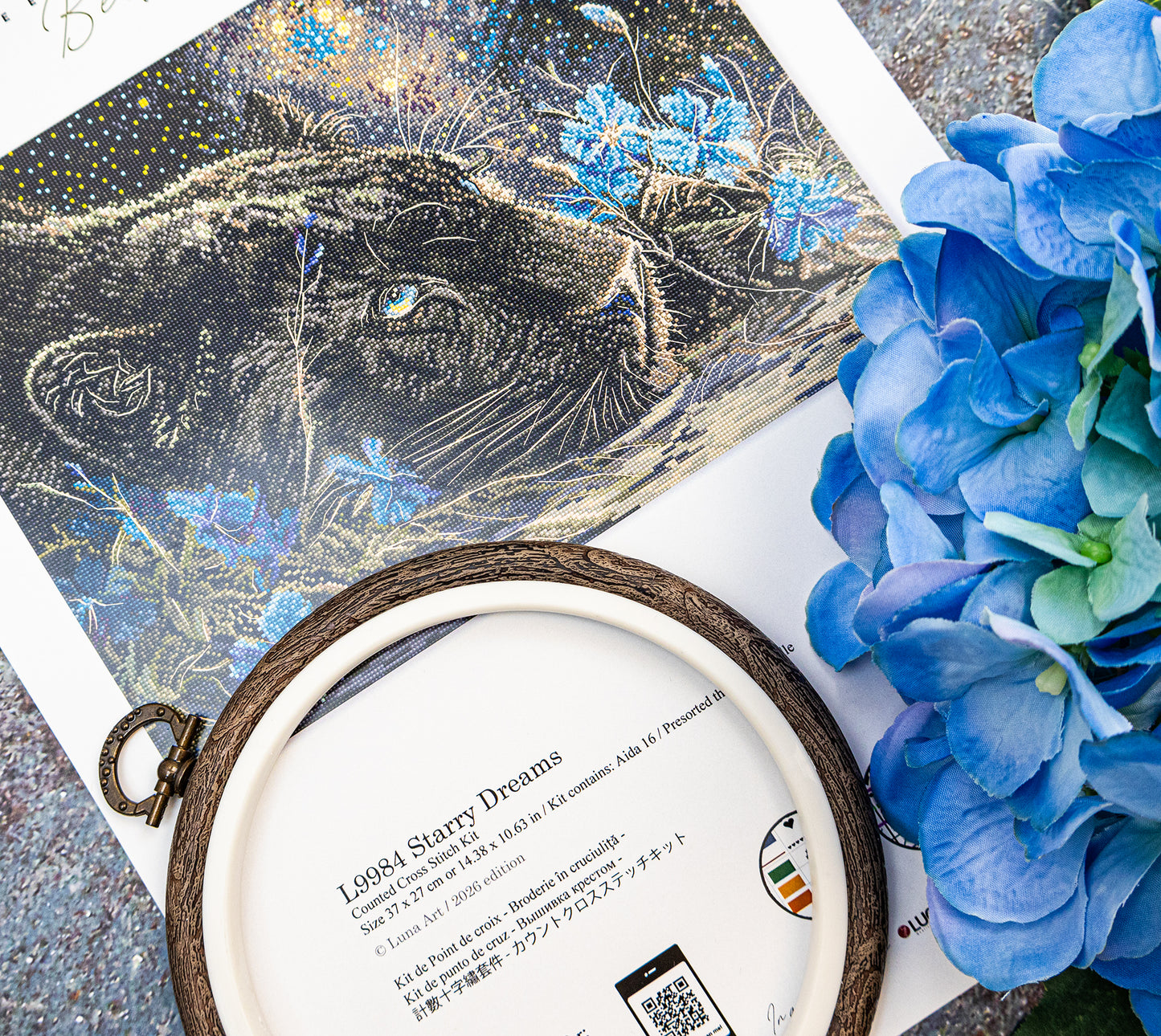Decorative item with a panther illustration and blue flowers on a textured surface.