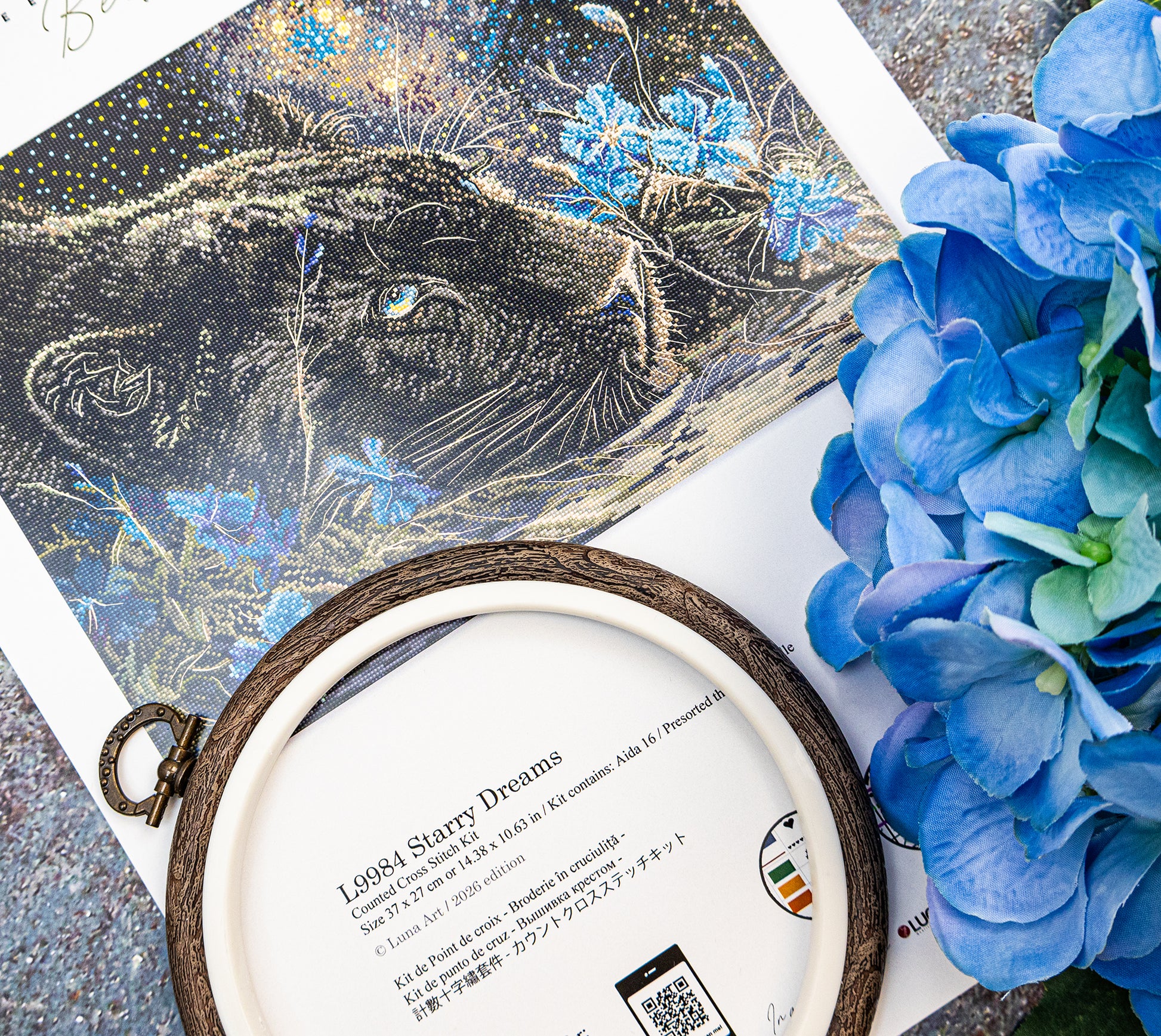 Decorative item with a panther illustration and blue flowers on a textured surface.