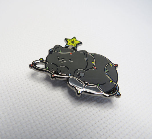 Black cat-shaped  needleminder with a star on a white background