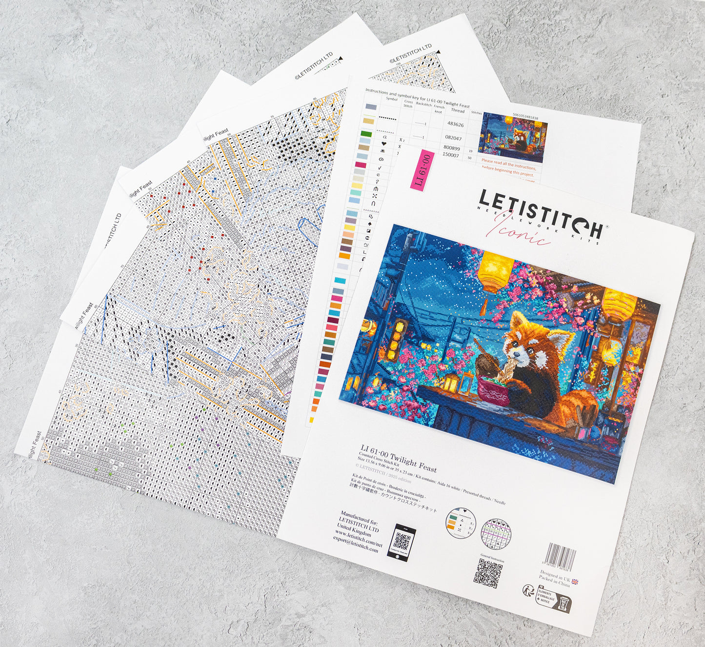 Letistitch embroidery kit with pattern sheets on a gray surface