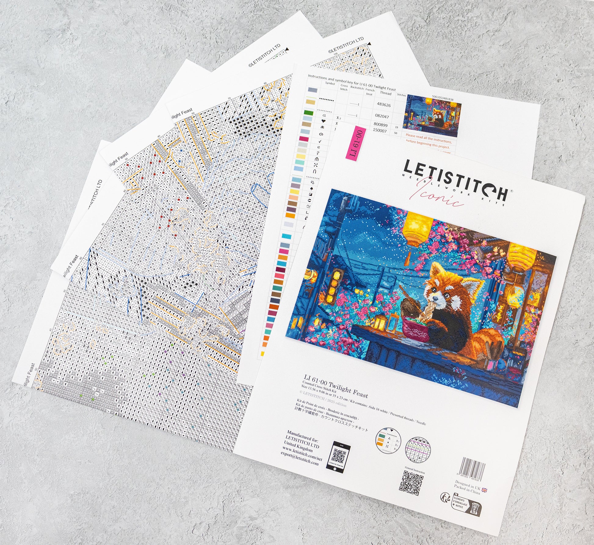 Letistitch embroidery kit with pattern sheets on a gray surface