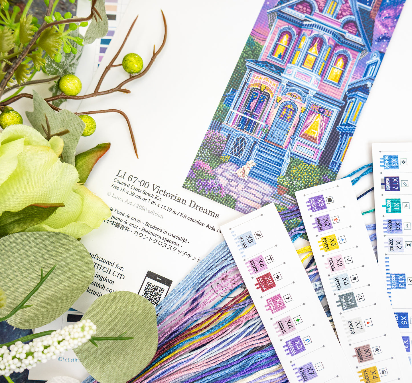 Color swatches and fabric samples with a scenic design and floral elements.