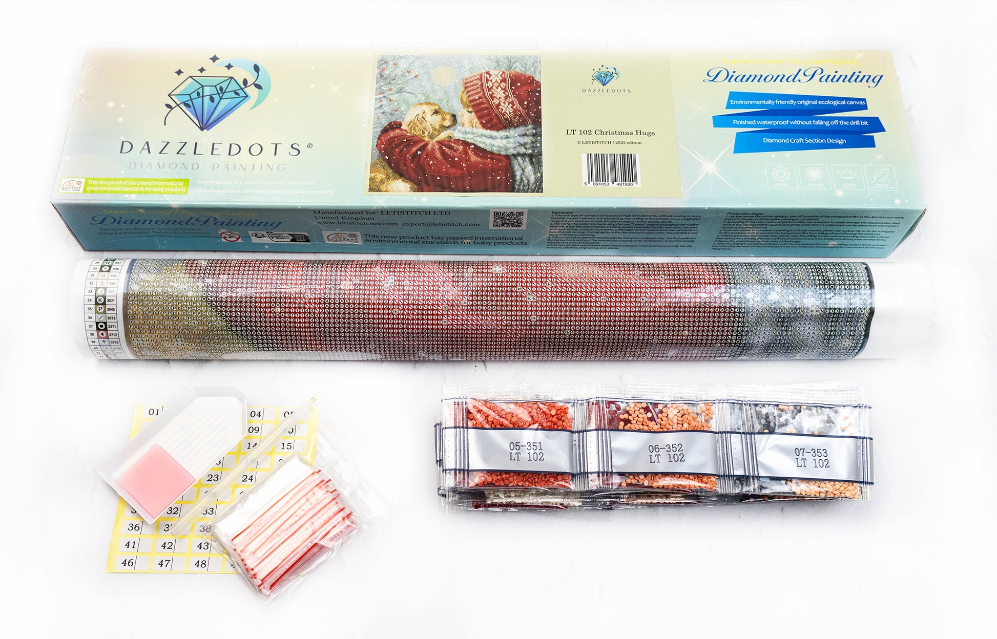 Diamond painting kit with roll of mesh, colors, and packaging on a white background