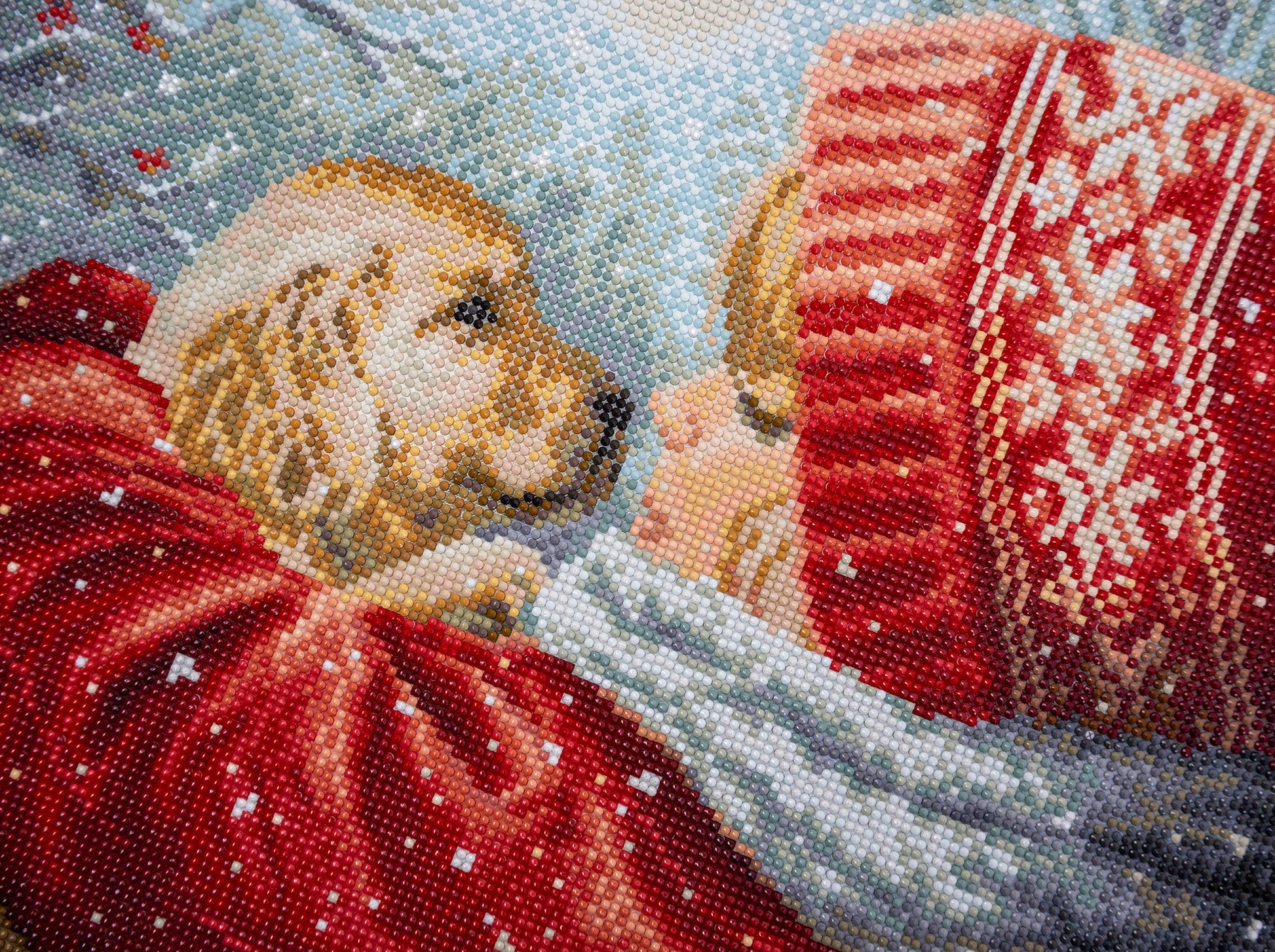 diamond art club kit with a girl wearing red sweaters in a snowy scene 