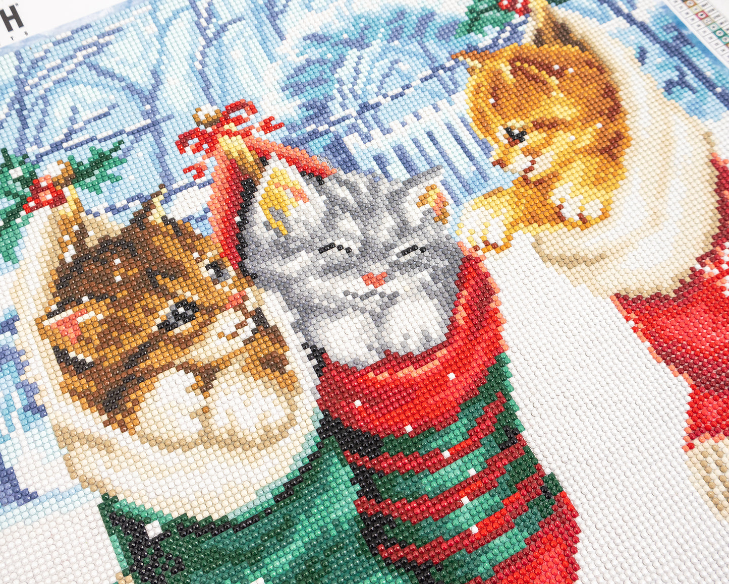 Christmas-themed crystal art picture with cats in festive outfits