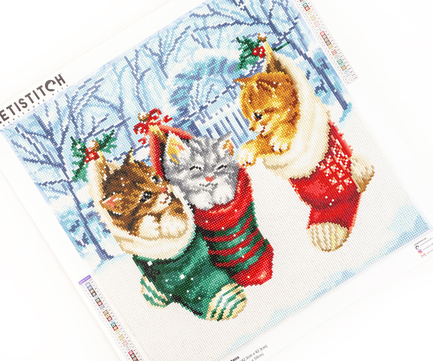 Dazzle dots damond art club design of cats in Christmas stockings on a white background