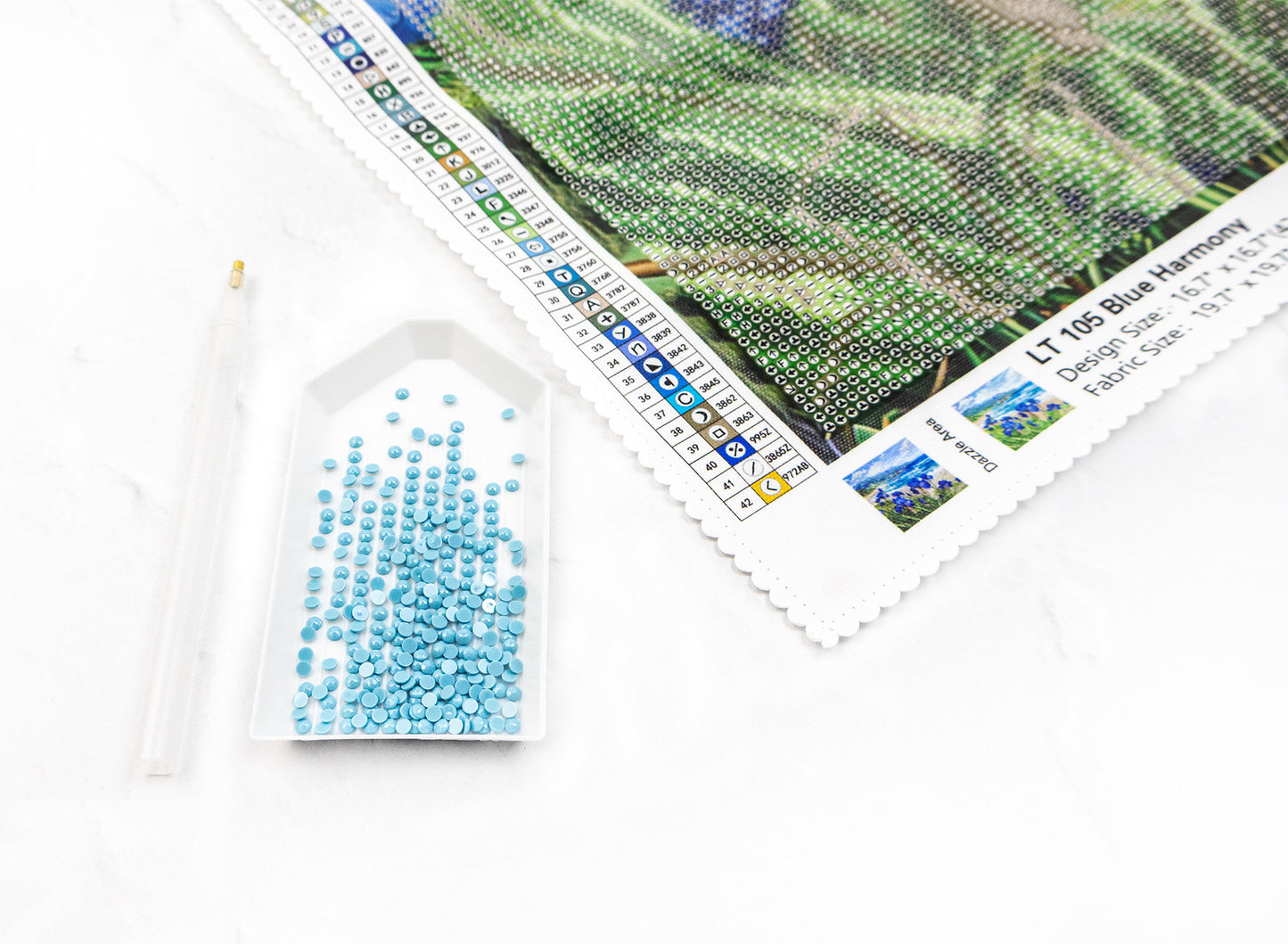 Diamond Art club kit crystals in a white tray stylus and canvas