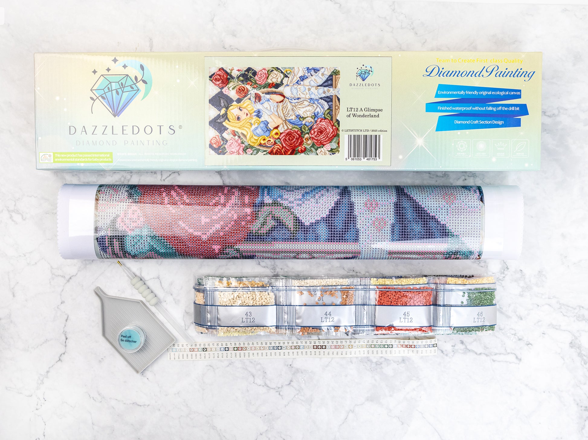 Diamond painting kit with materials on a white background