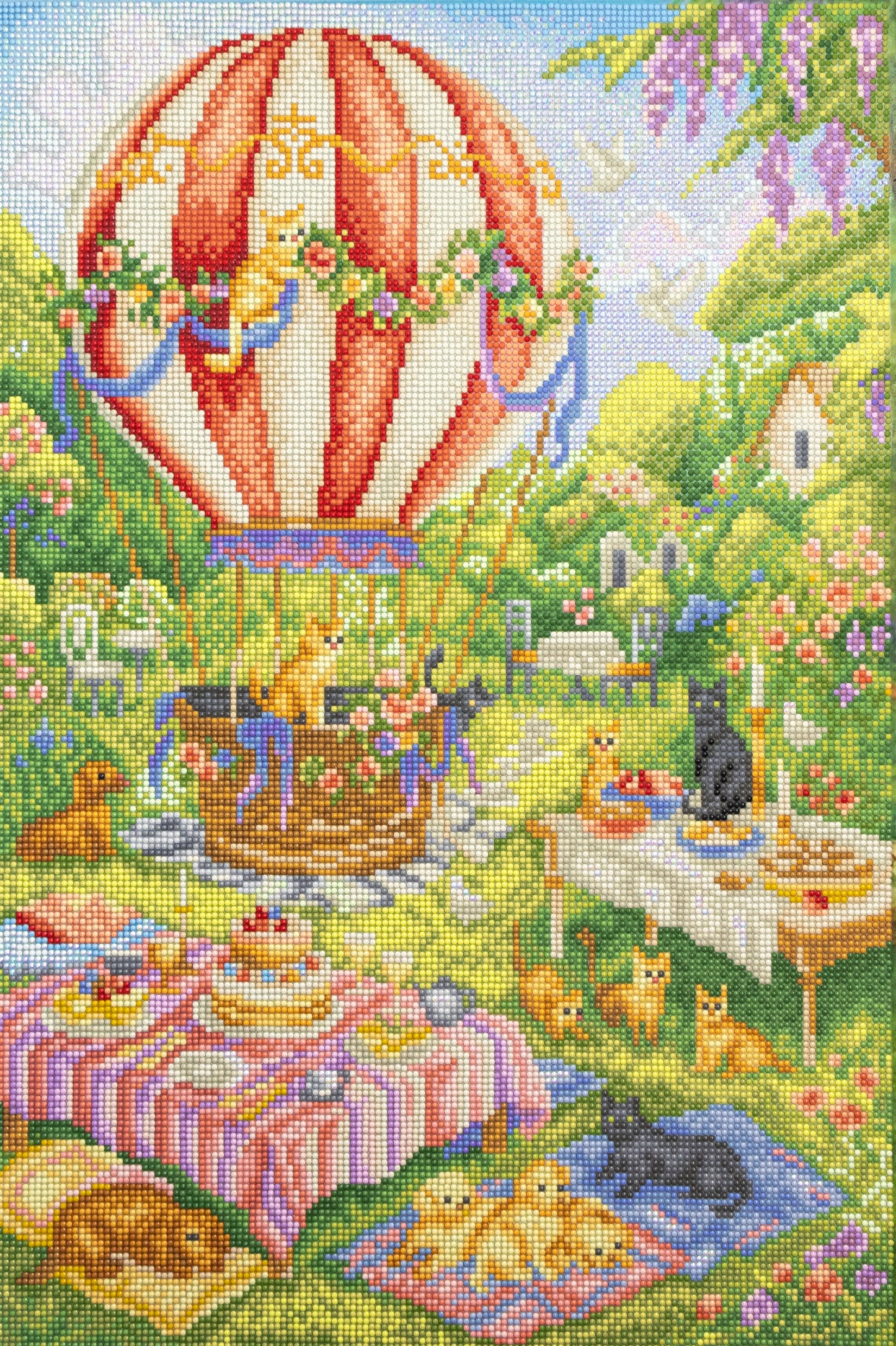 Diamond Painting kit of a hot air balloon in a garden with animals and picnic setup