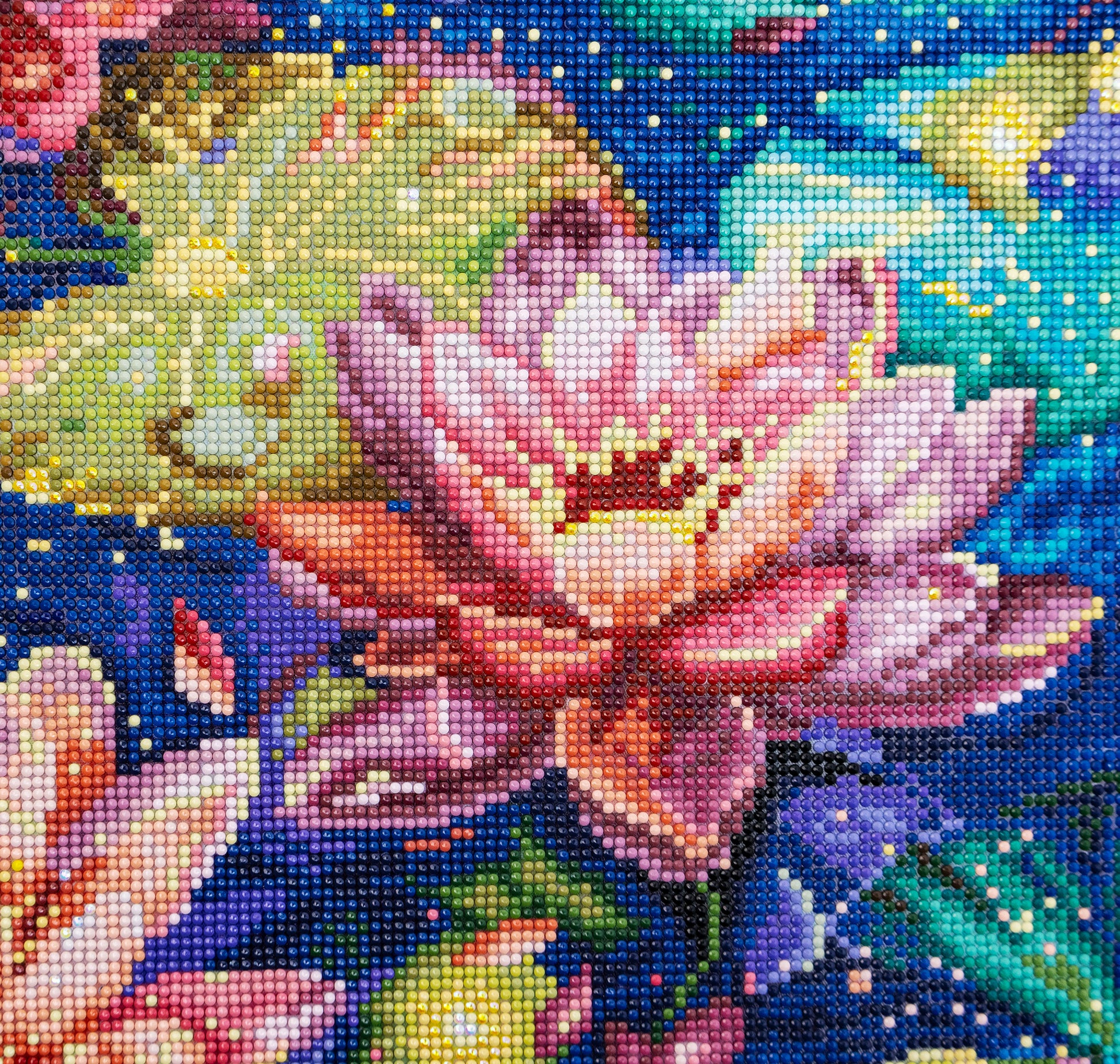 Colorful diamond painting of a flower with a starry night background