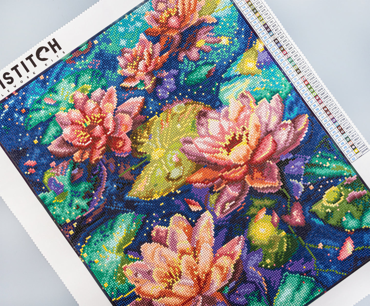 crystal art pattern with pink flowers on a blue background