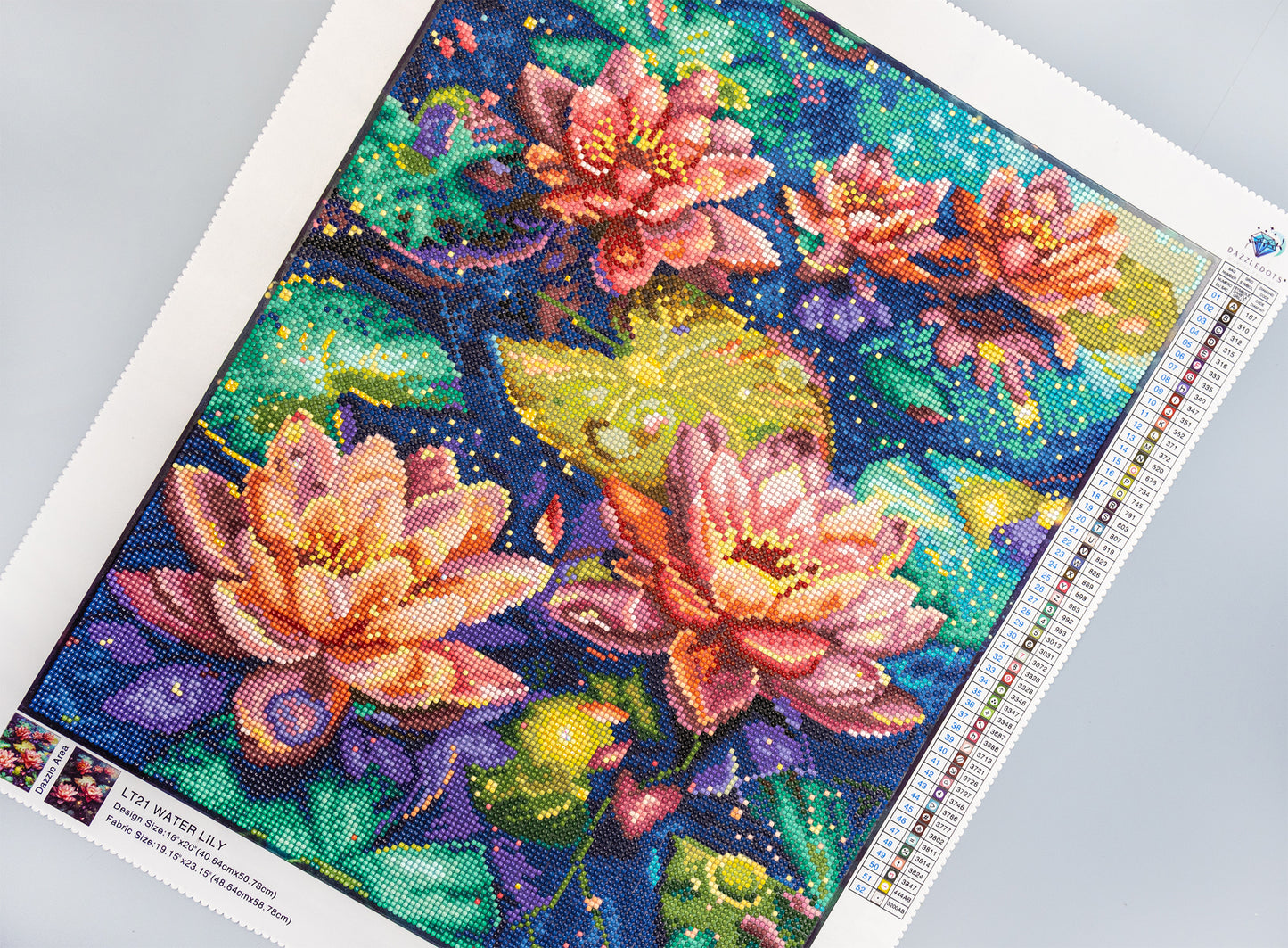 Colorful diamond painting of water lilies on a gray surface