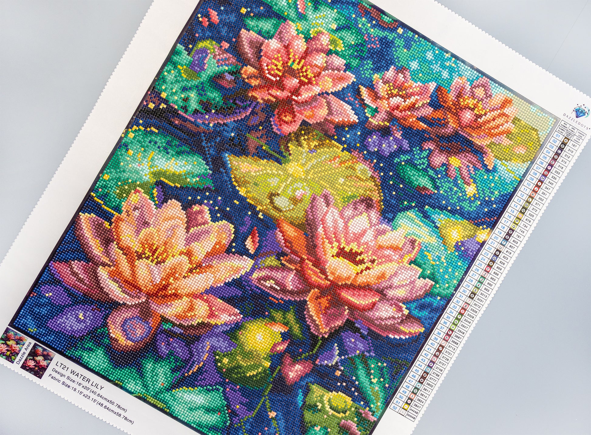 Colorful diamond painting of water lilies on a gray surface
