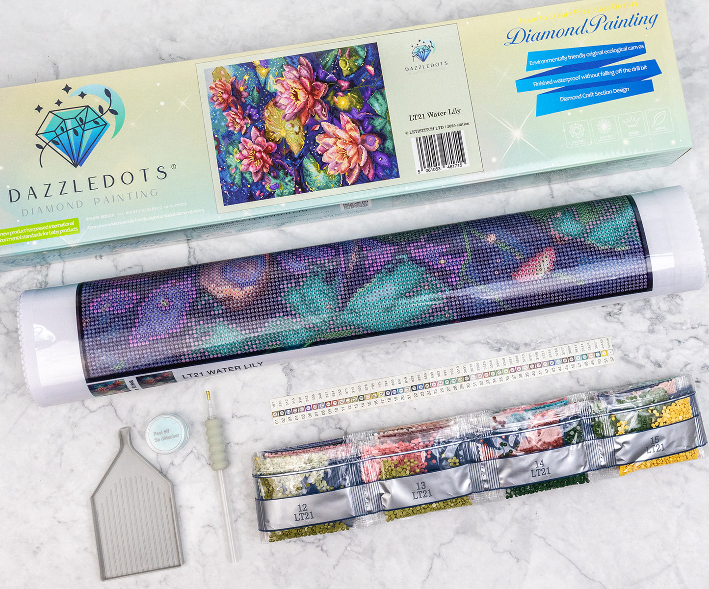 DAZZLEDOTS diamond painting kit with roll of paper and tools on a white background