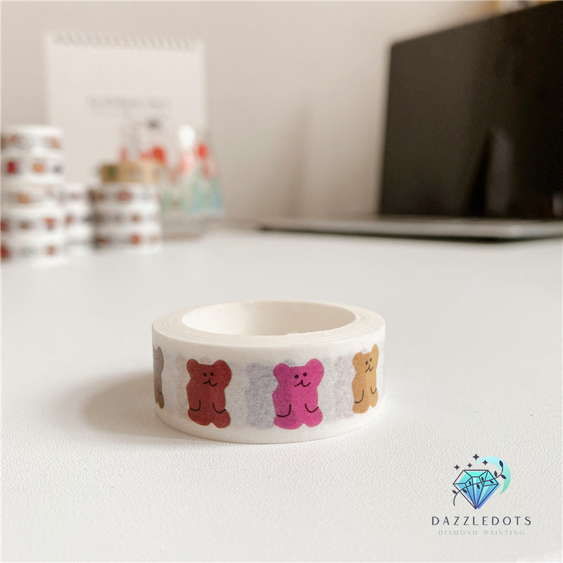 Roll of decorative tape with bear designs on a desk