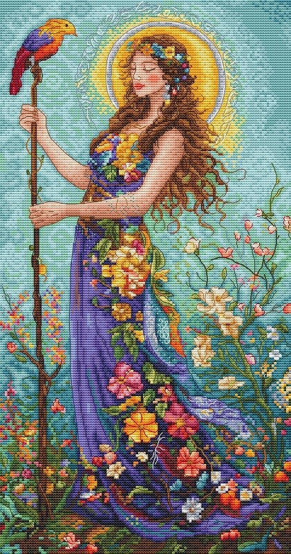 Cross stitch kit, Woman in a floral dress with a parrot, surrounded by flowers and plants on a blue background
